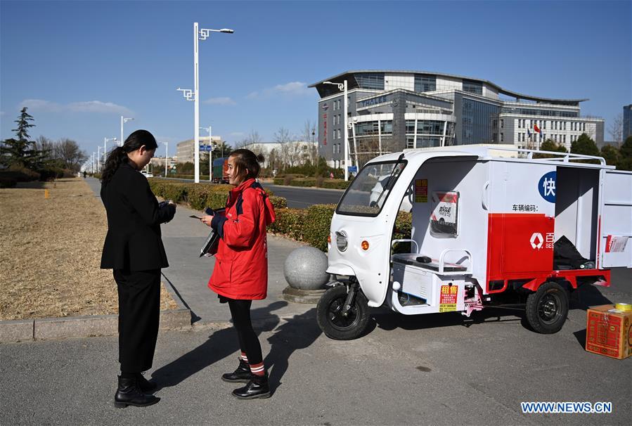 CHINA-BEIJING-DELIVERY WOMAN (CN)