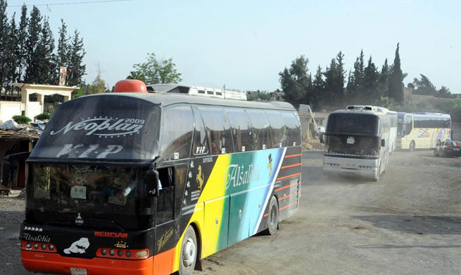 Rebels evacuate from Damascus' Douma as chemical weapons investigators expected