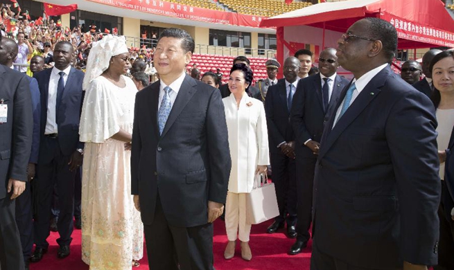 Xi attends handover ceremony of Senegal's national wrestling arena